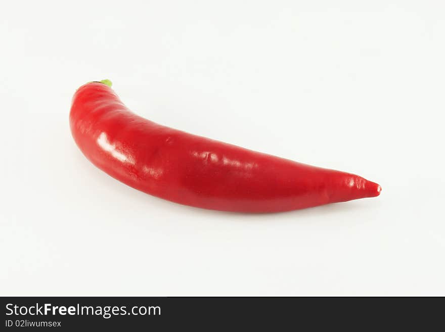 Hot red chili pepper on a white background, isolated