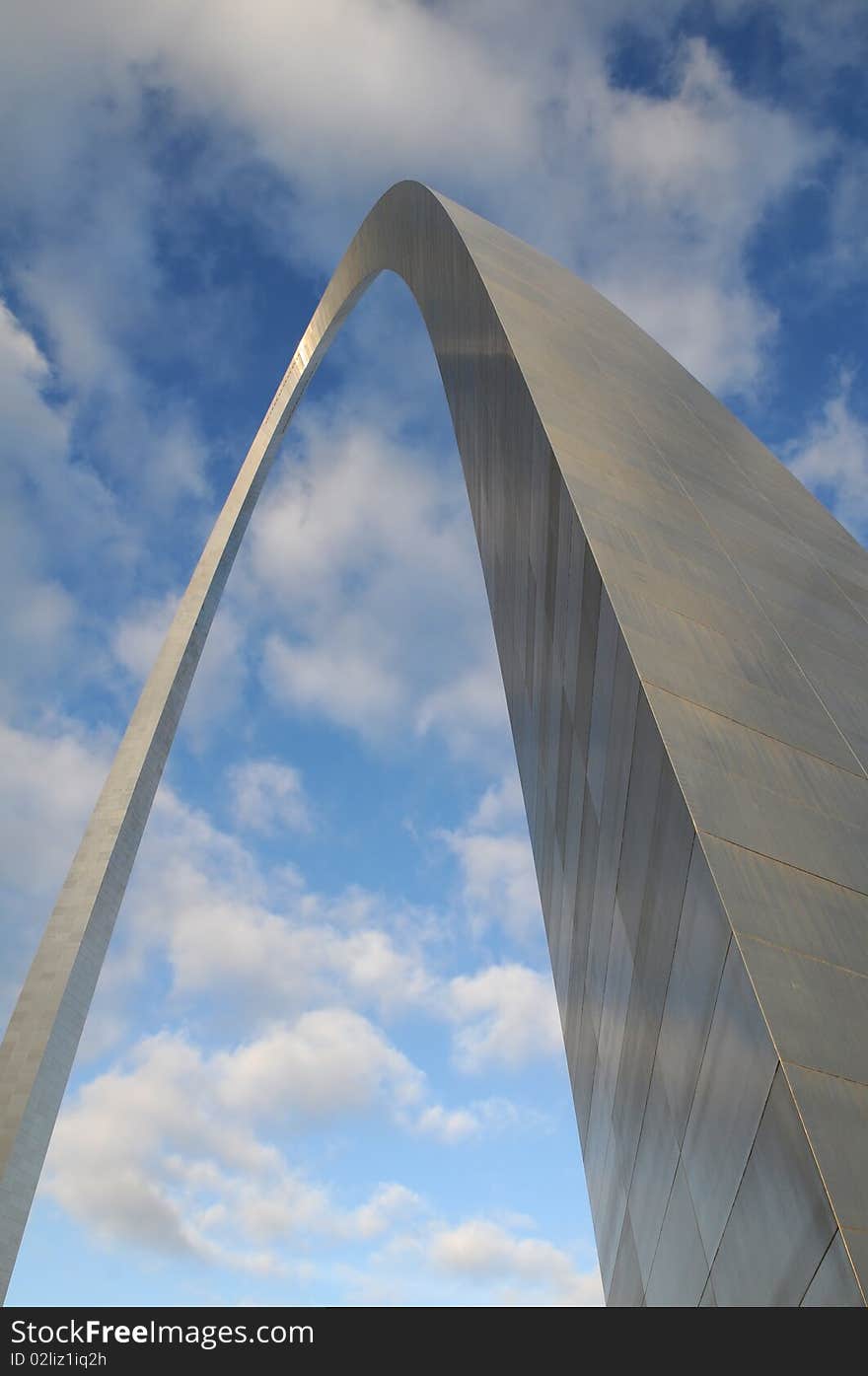 Saint Louis Arch against blue sky and clouds