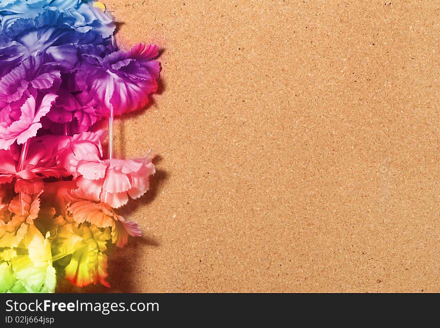 Floral frame of wood with fake plastic flowers