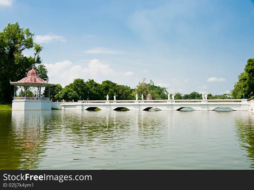 A white bridge cross over a pond, Ayutthaya Thailand. A white bridge cross over a pond, Ayutthaya Thailand.