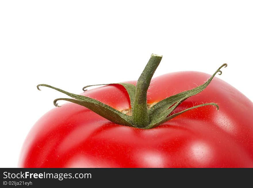 One tomato fragment macro shot isolated over white background