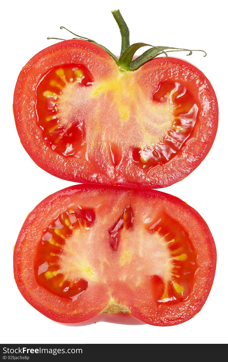 Two halves of tomato isolated over white background