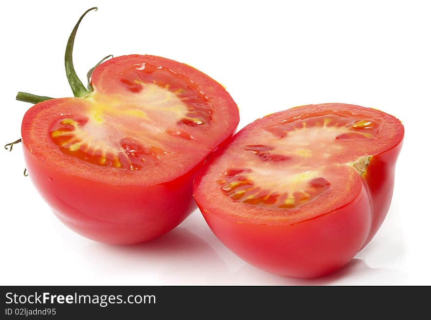 Two halves of tomato isolated over white background