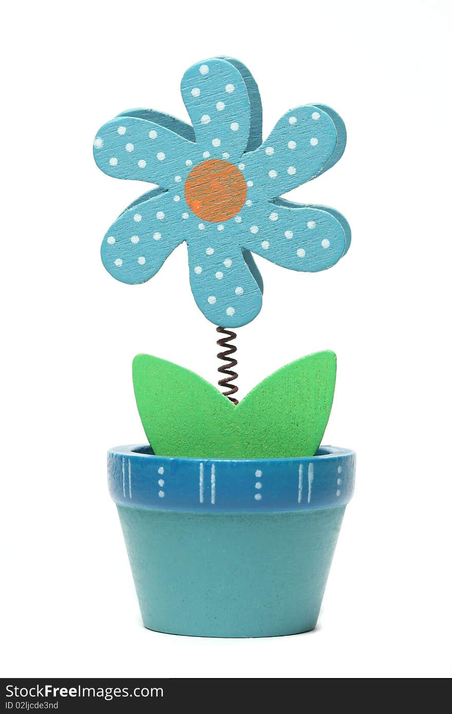 Small fake wooden flower isolated