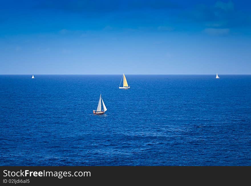 Sailboats on the Caribbean Sea with beautiful Blue Skies