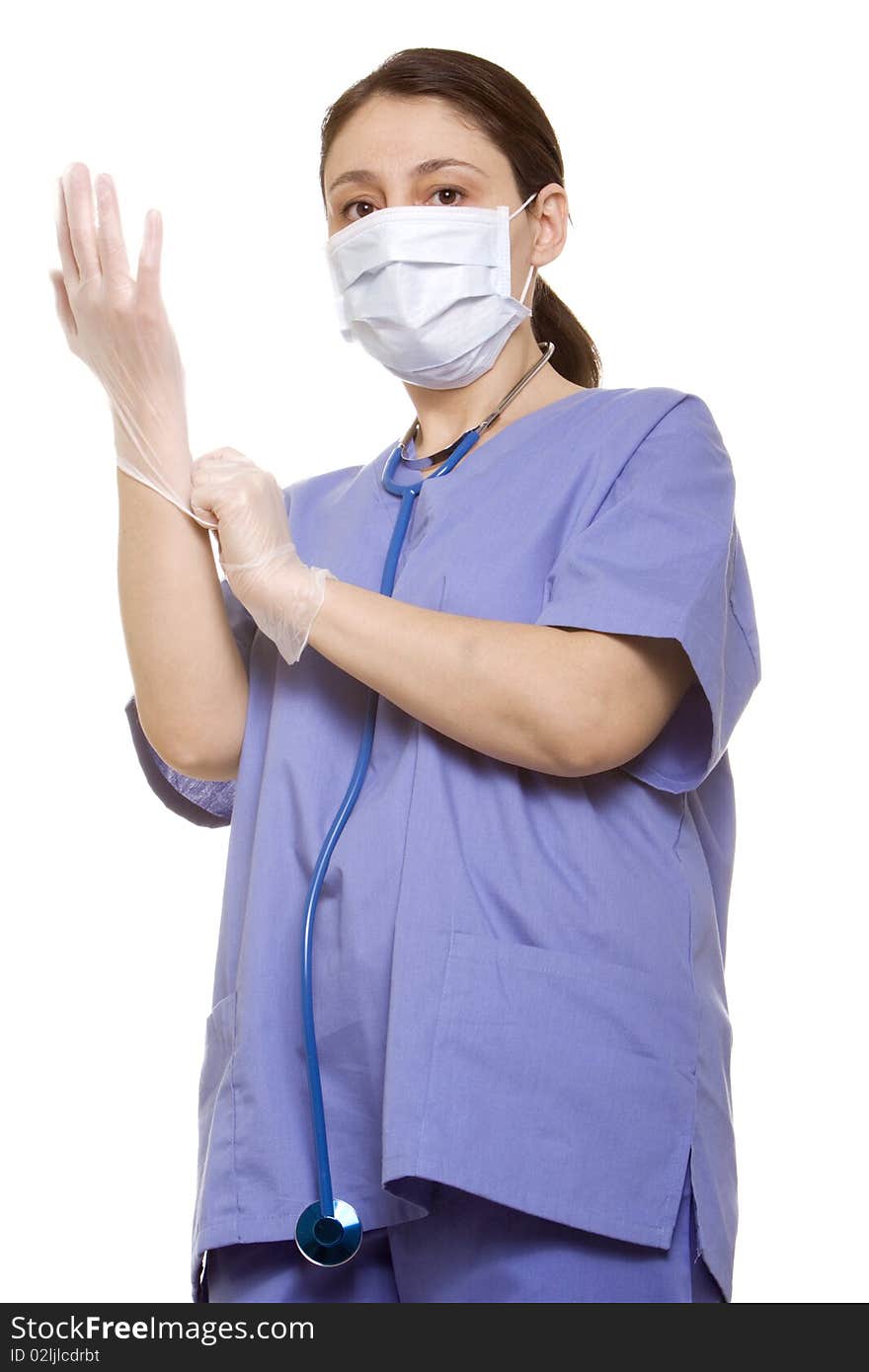 Doctor putting her gloves on before surgery