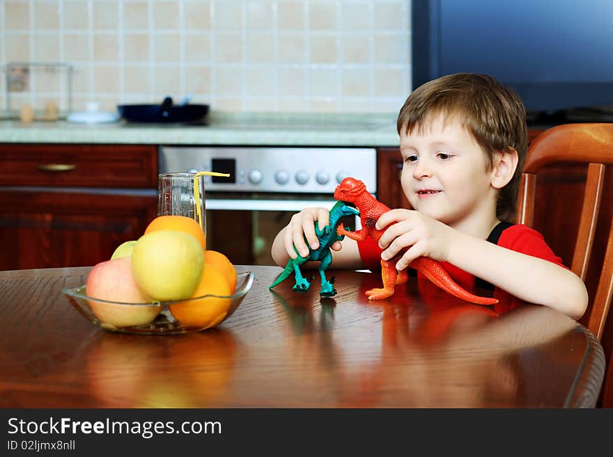 Little boy is playing with his toys at home. Little boy is playing with his toys at home.