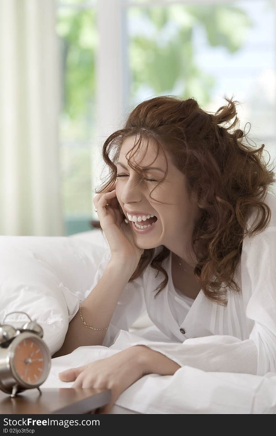 Portrait of nice young woman waking up in her bedroom. Portrait of nice young woman waking up in her bedroom