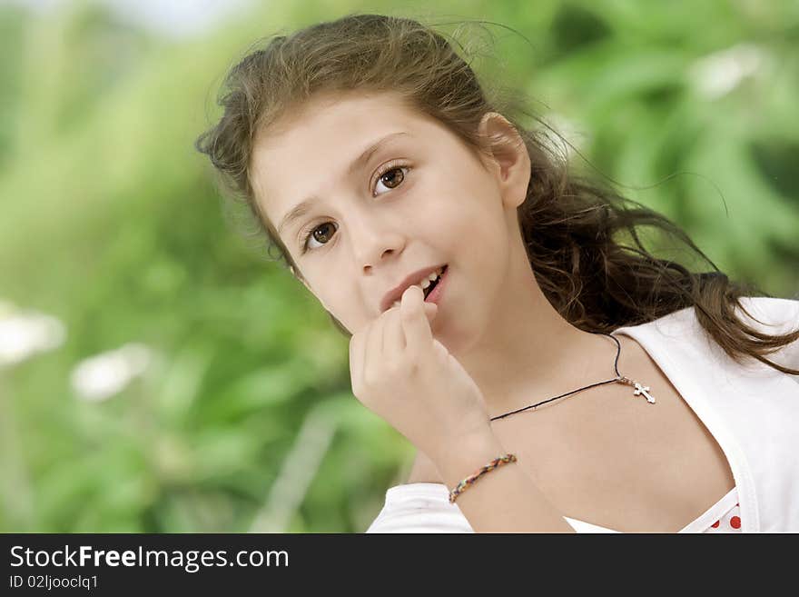 Portrait of nice little girl in summer environmentм. Portrait of nice little girl in summer environmentм