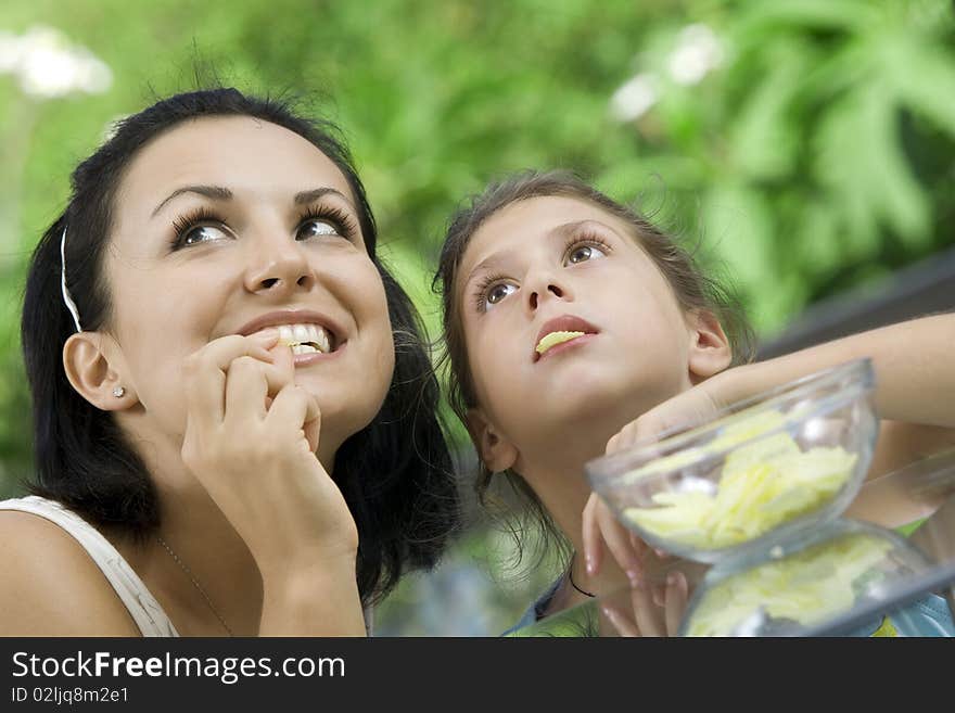 Portrait of happy mother with daughter  having good time in summer environment. Portrait of happy mother with daughter  having good time in summer environment