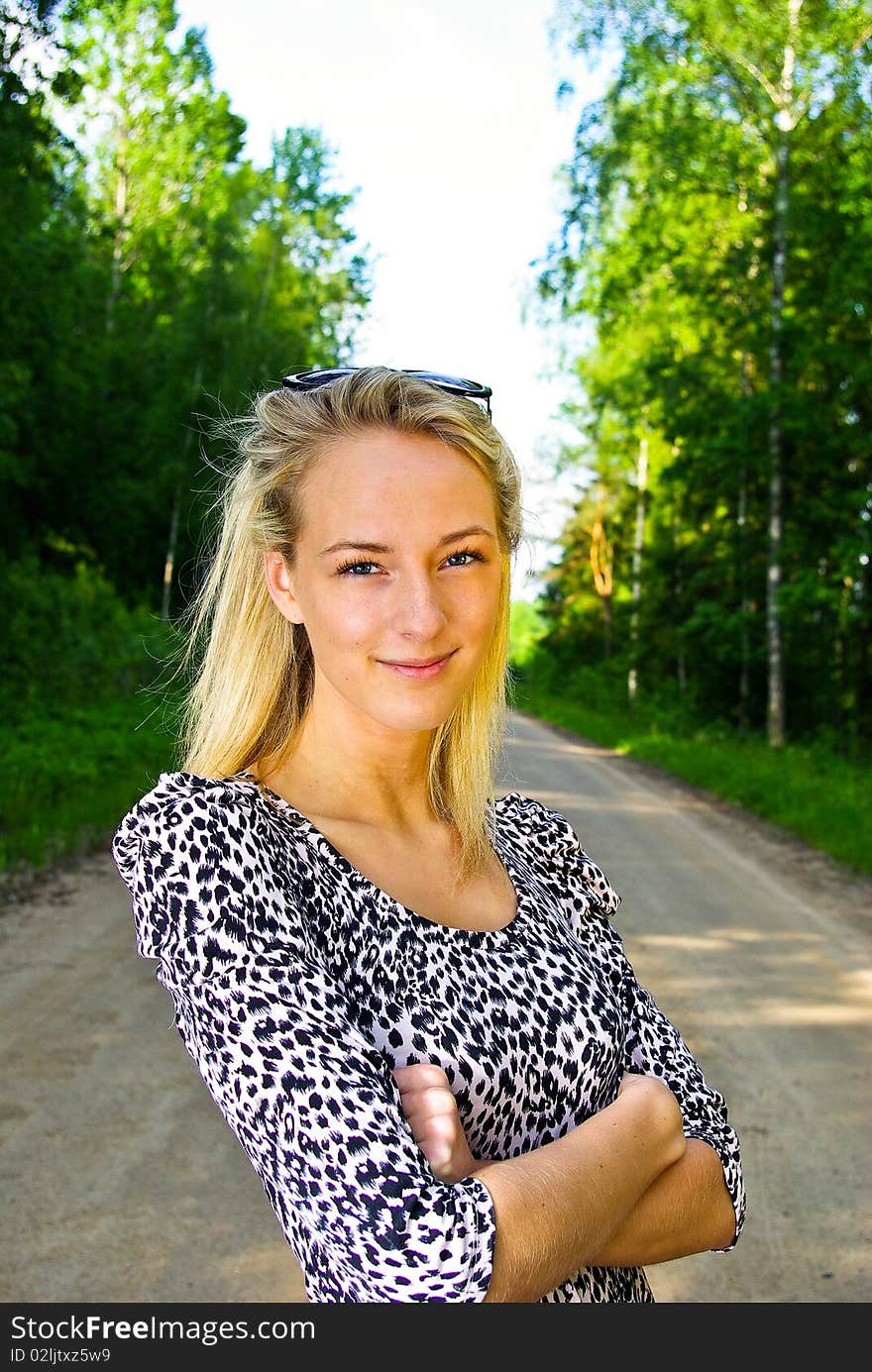 Beautiful young woman looking confident on nature background. Beautiful young woman looking confident on nature background