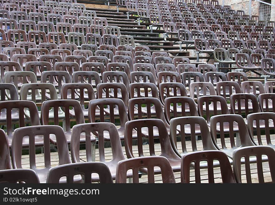 Chairs on the auditorium of an open-air theatre.