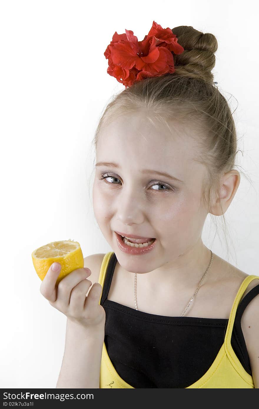 Girl eating an lemon