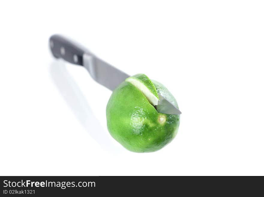 A Lime Section Cut By A Chefs Knife