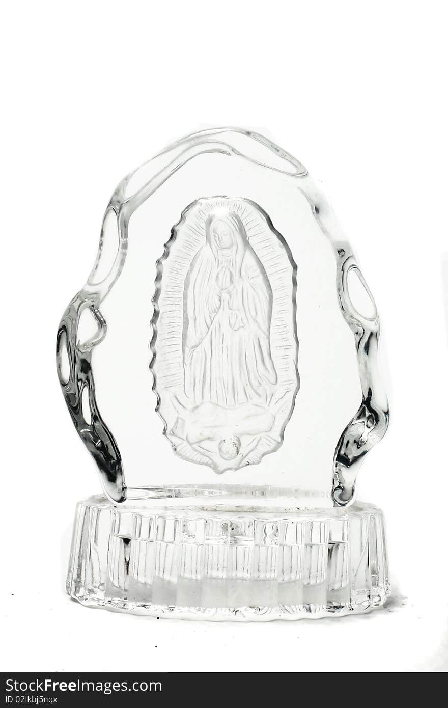 Glass sculpture of virgin mary isolated