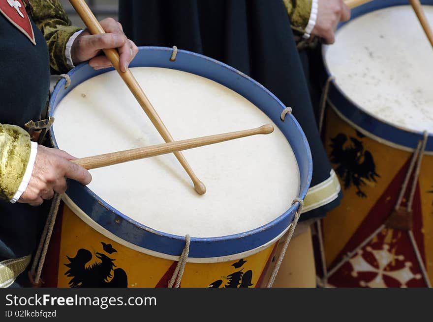 Drums played during a re-enactment. The people are in costumes.