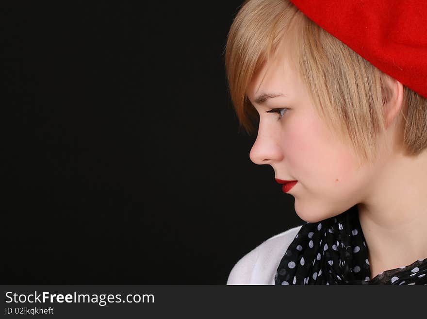 Beautiful young blond female wearing a red hat. Beautiful young blond female wearing a red hat