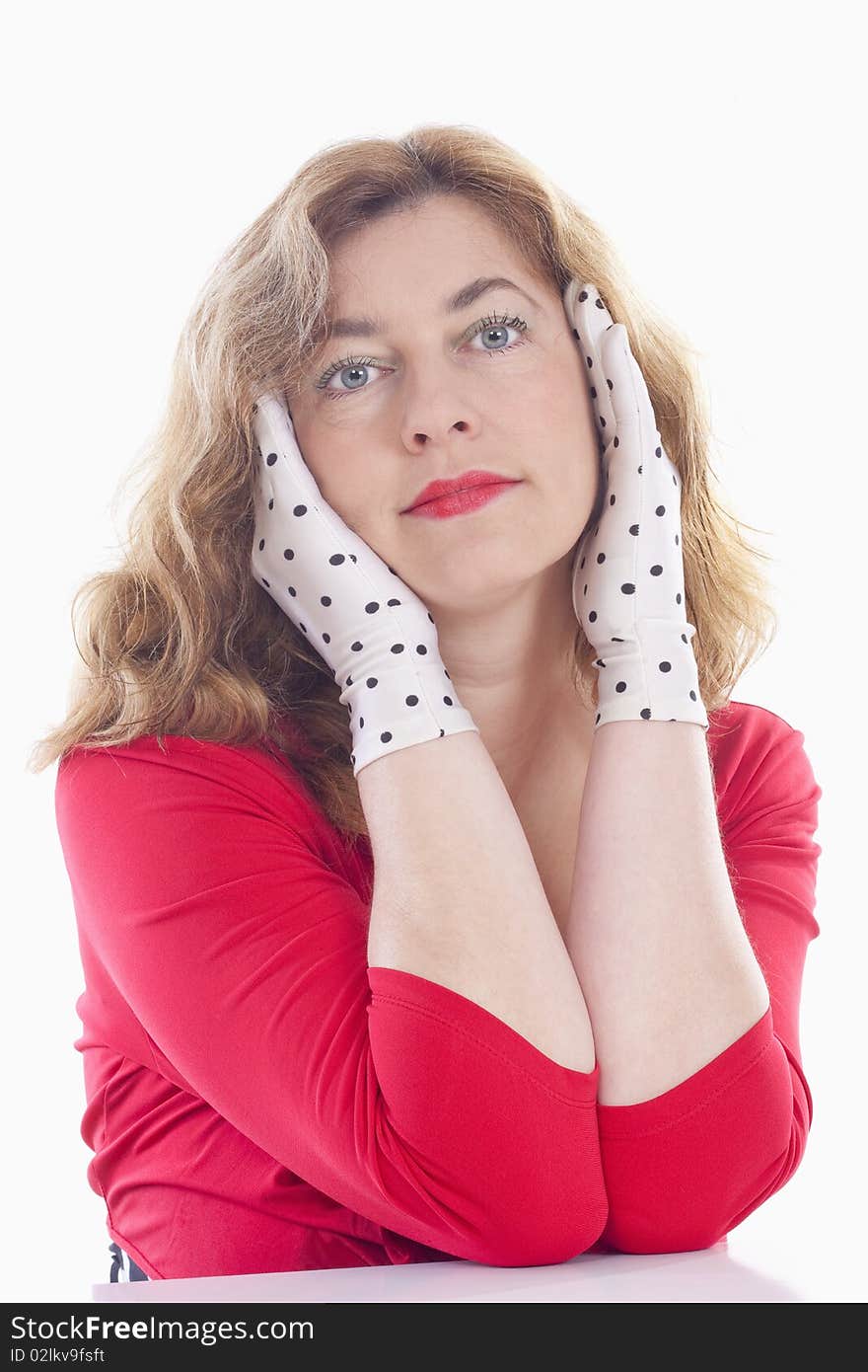 Portrait of a middle-aged woman in red with polka-dot gloves - isolated on white. Portrait of a middle-aged woman in red with polka-dot gloves - isolated on white