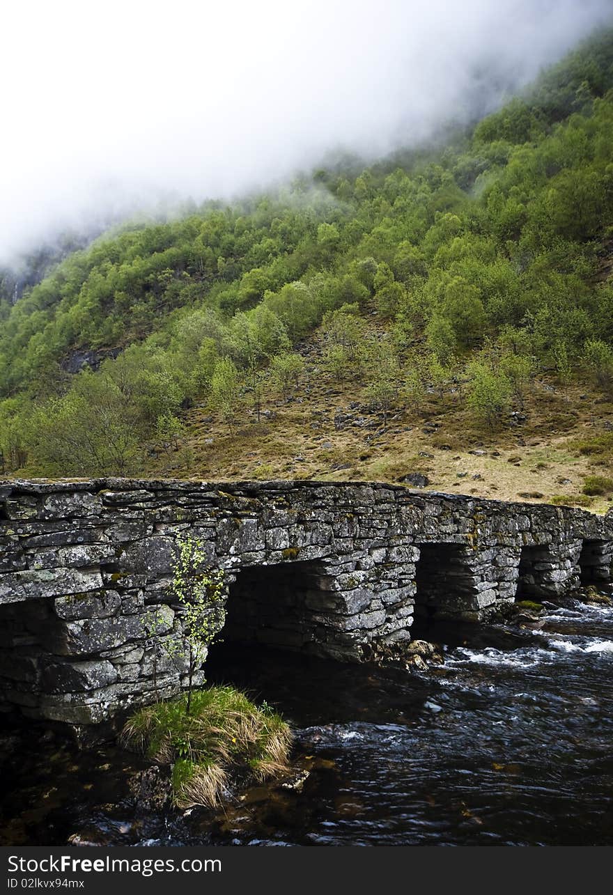 Part of a very old stone bridge in Norway