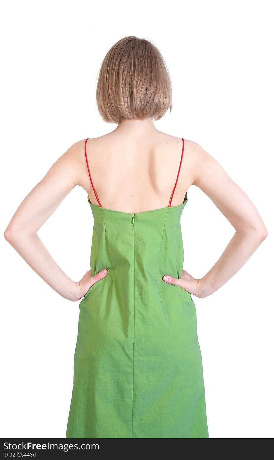 Backside of a young woman in green dress (isolated)