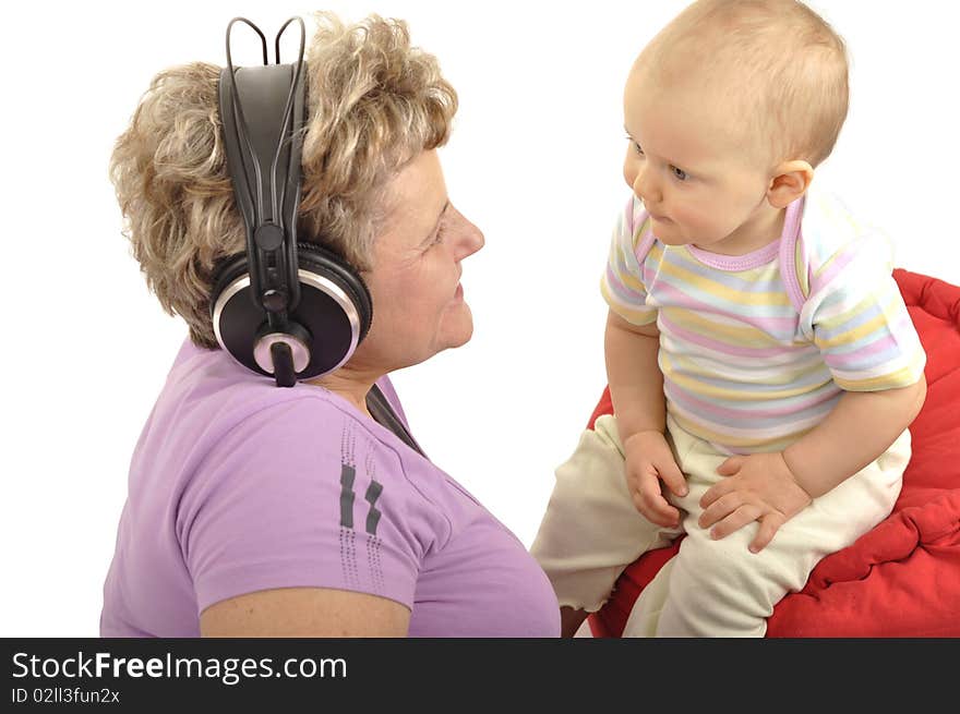 Grandmother with baby is listening music