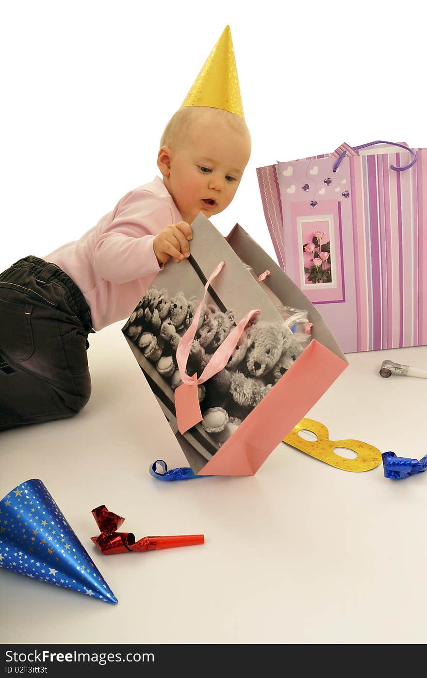 Little baby is playing on the flor during birthday party. Little baby is playing on the flor during birthday party