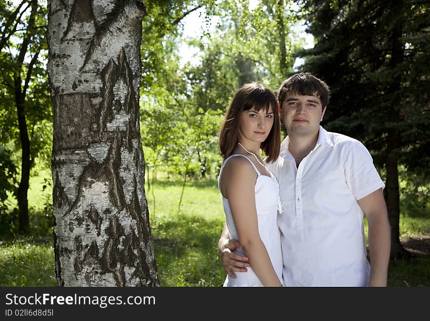 Woman and man posing in the middle of nature. Woman and man posing in the middle of nature