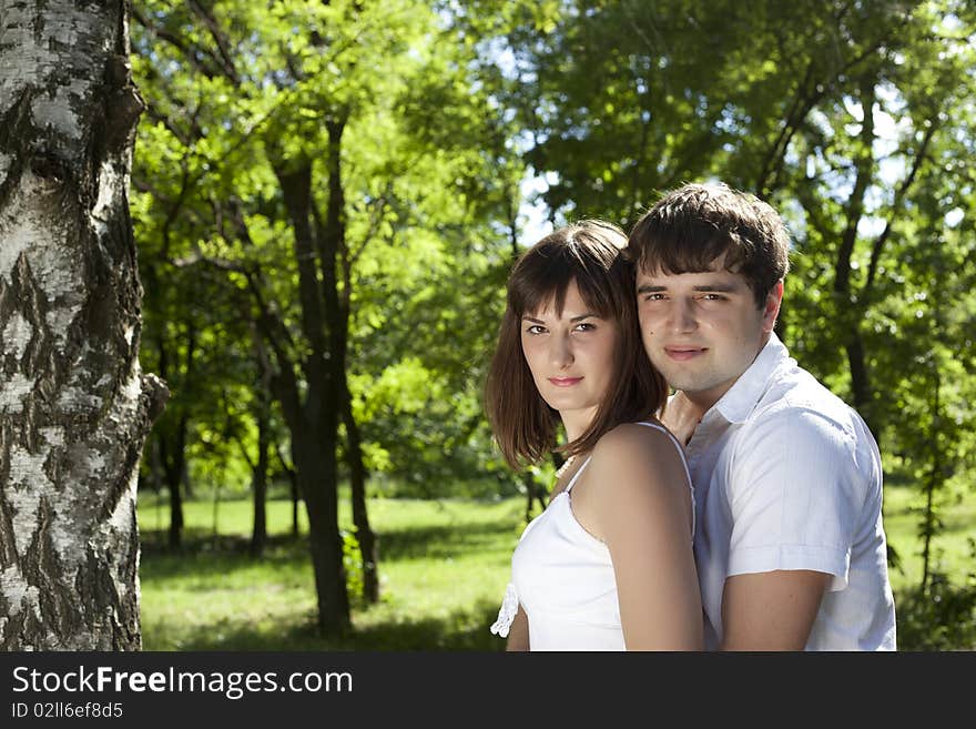 Woman and man posing in the middle of nature. Woman and man posing in the middle of nature