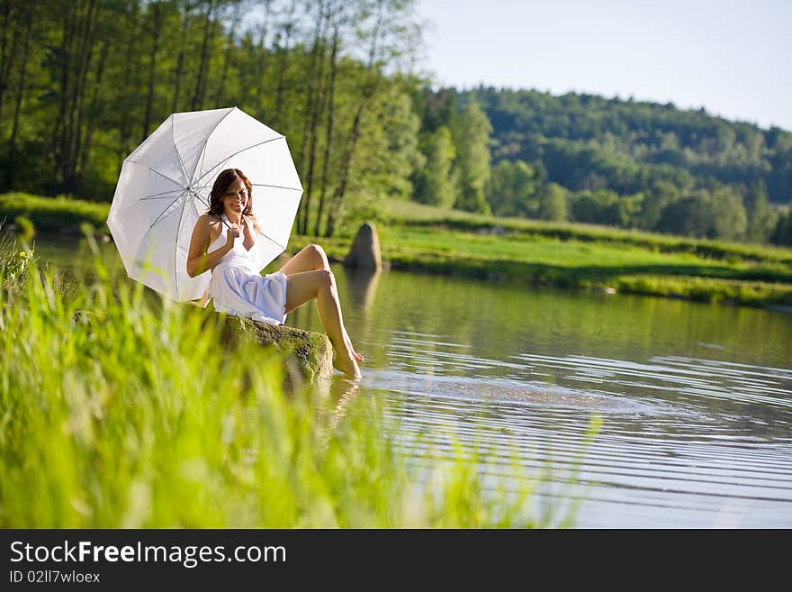 Spring - Happy Romantic Woman Sitting By Lake