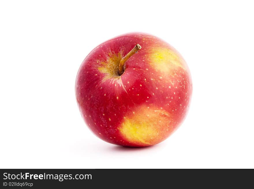 Red and yellow apple with a drop a shadow in white background