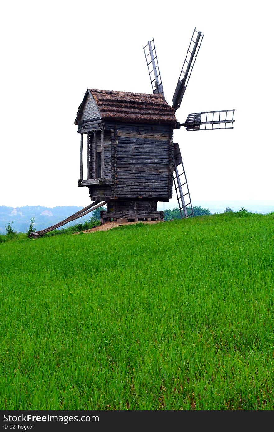 Old wind mill in a field. Old wind mill in a field