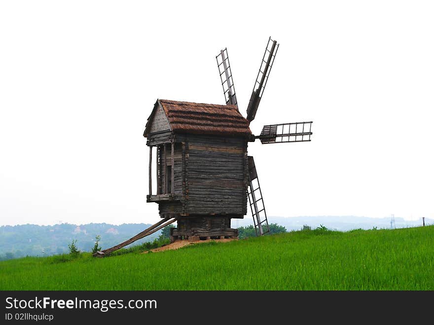 Old wind mill in a field