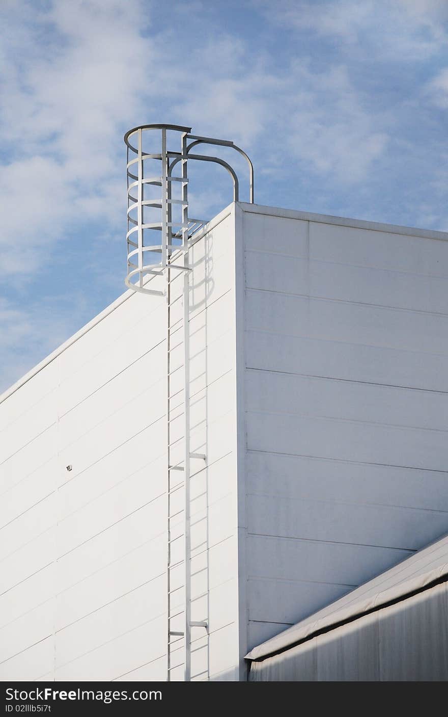 The steel ladder on a modern building. The steel ladder on a modern building.