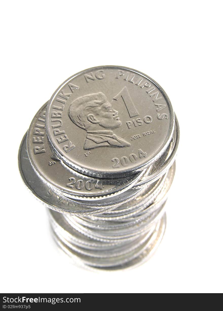 Stack of 1 peso coins from Philippines on white background