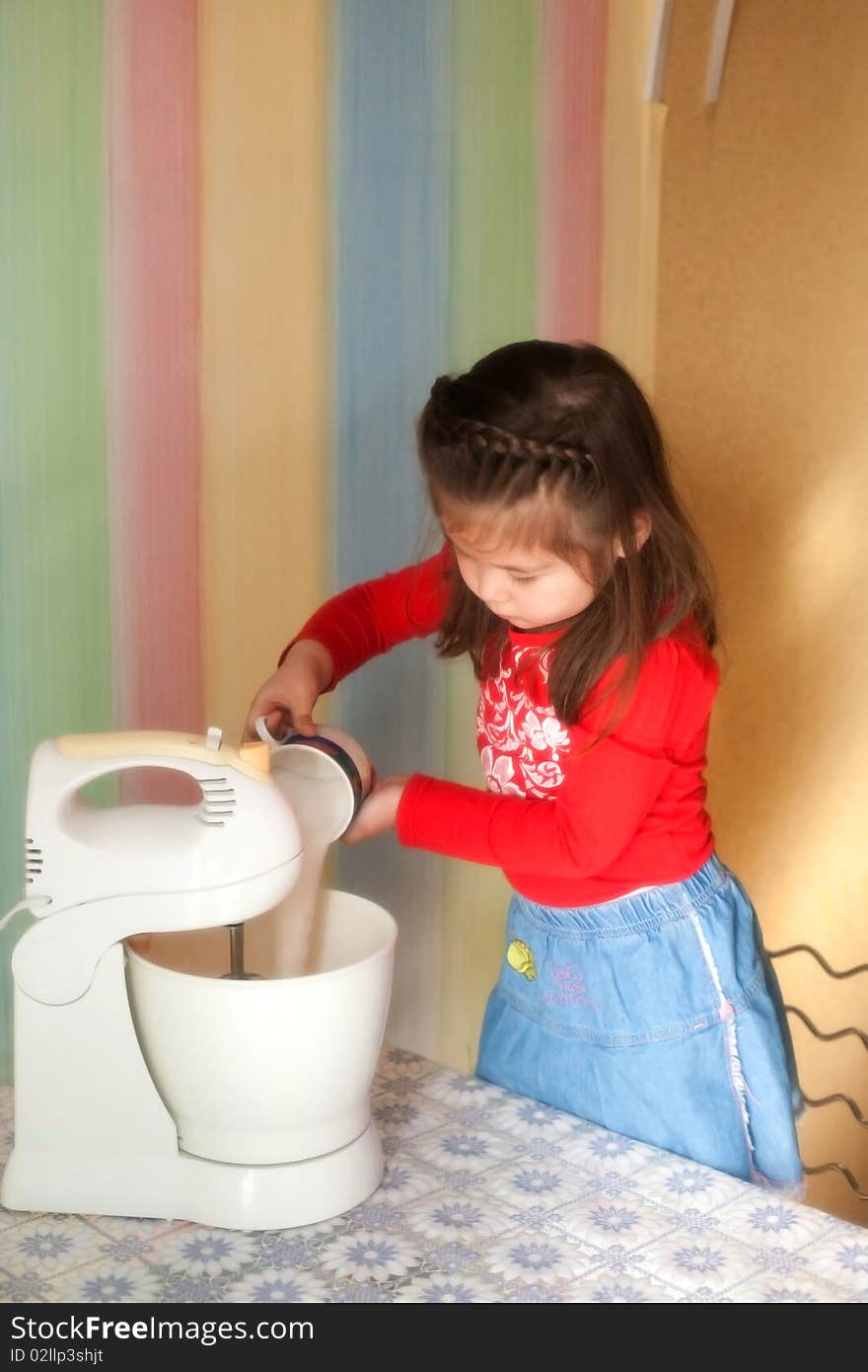 Girl helps her mother in cooking apple pie. Girl helps her mother in cooking apple pie