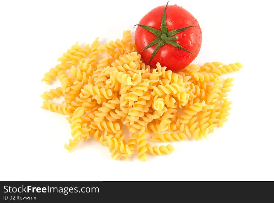 Italian pasta fusilli and tomatoes on white background