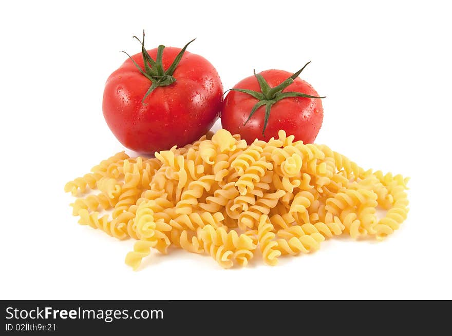 Italian pasta fusilli and tomatoes on white background