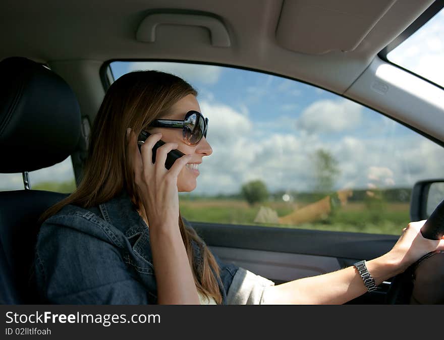 The girl at the wheel the car