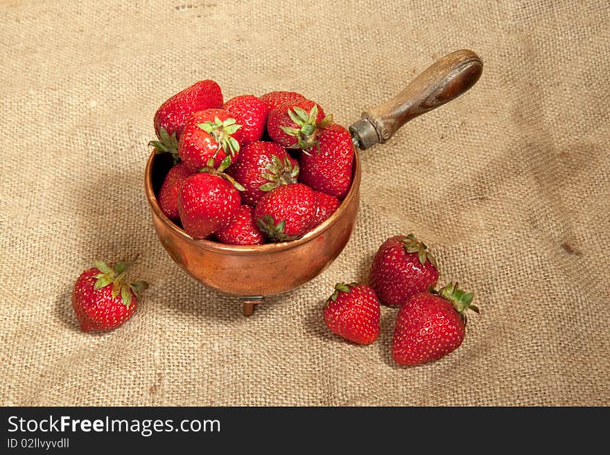 Strawberry in a copper bowl