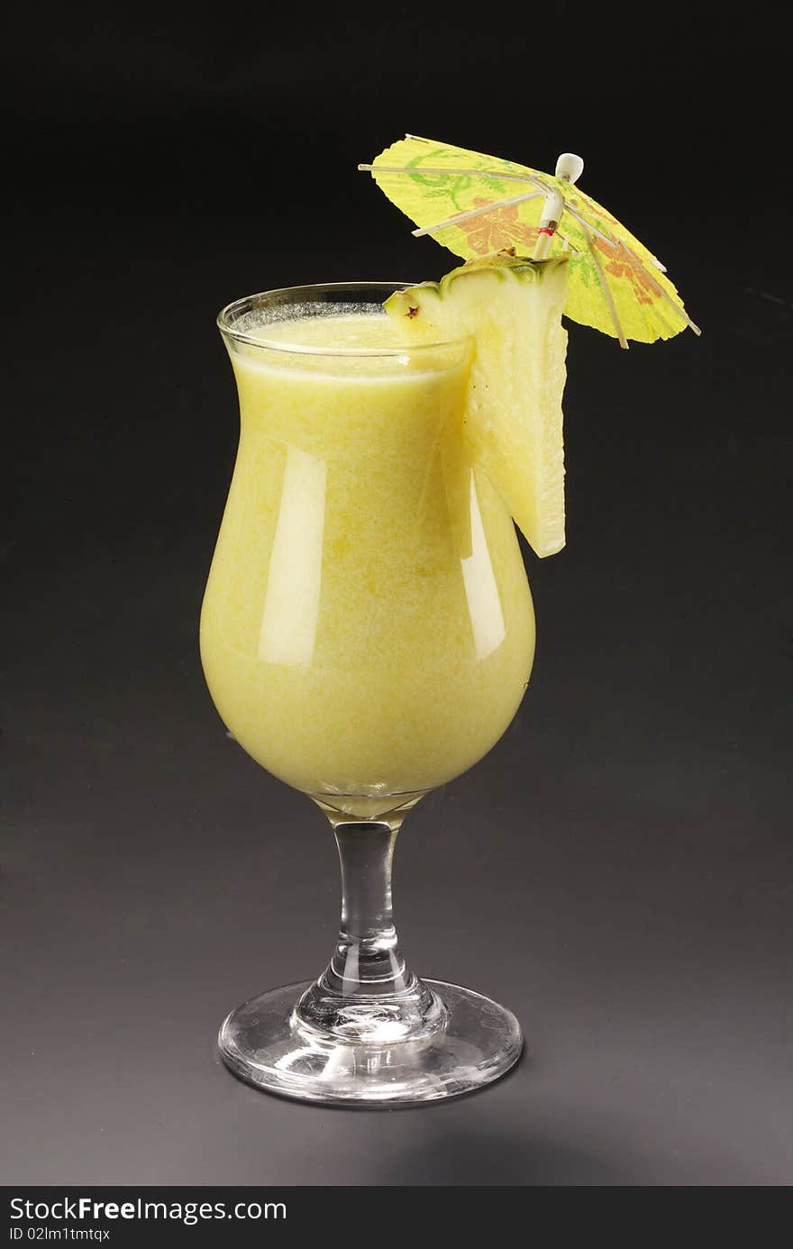 Tasty alcohol cocktail with pineapple