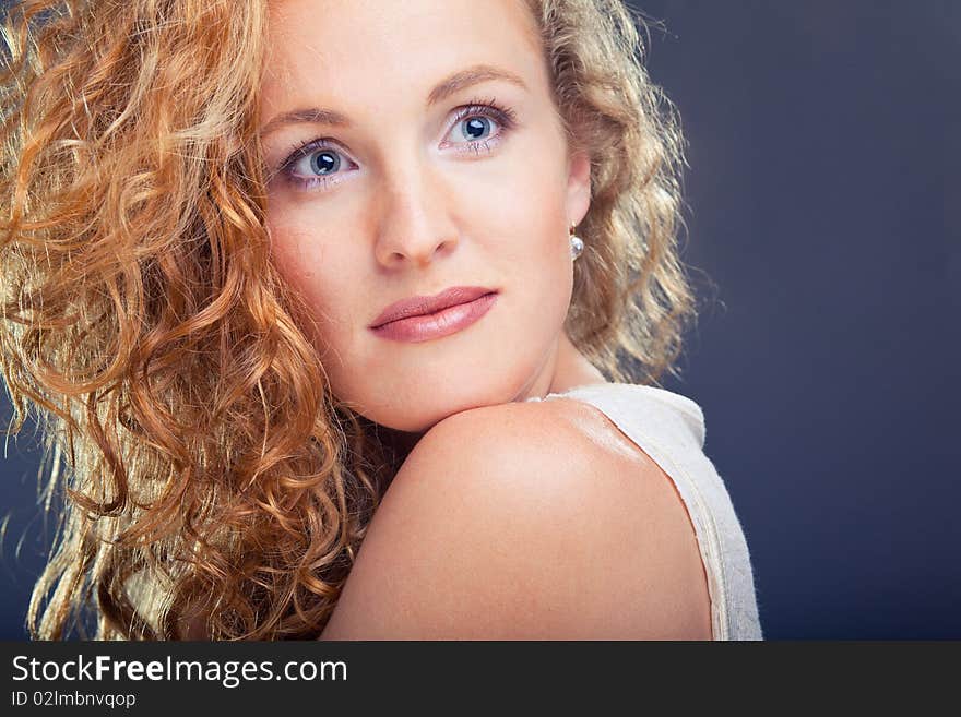 Portrait of beautiful lady on blue