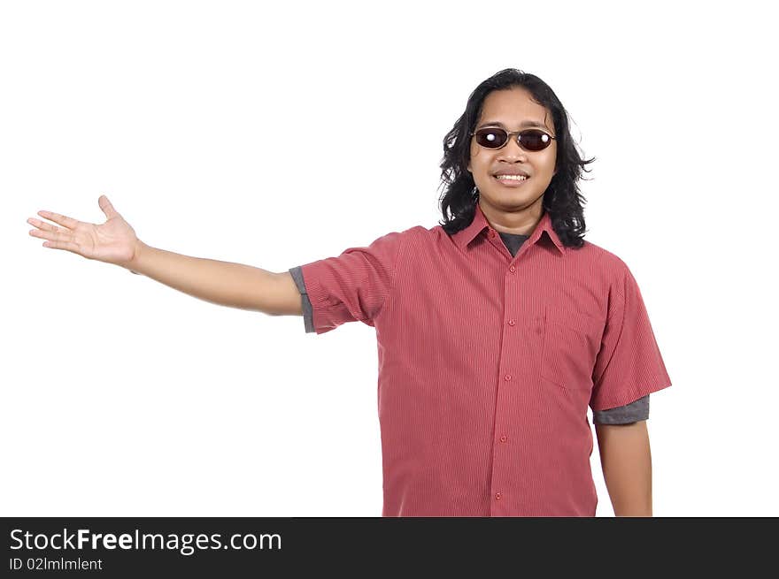 Long hair man with sunglasses pointing something isolated on white background