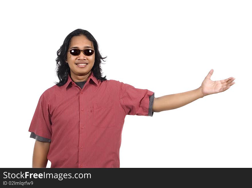 Long hair man with sunglasses pointing something isolated on white background