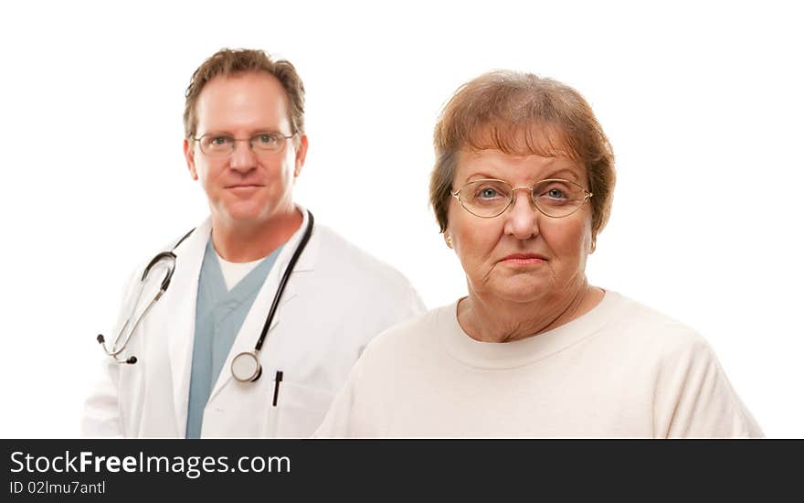 Concerned Senior Woman with Male Doctor Behind Isolated on a White Background. Concerned Senior Woman with Male Doctor Behind Isolated on a White Background.