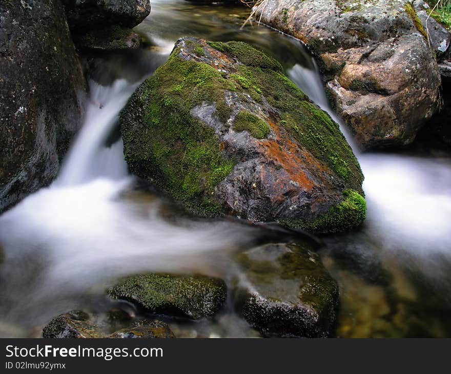 Beautiful flowing water of mountain stream