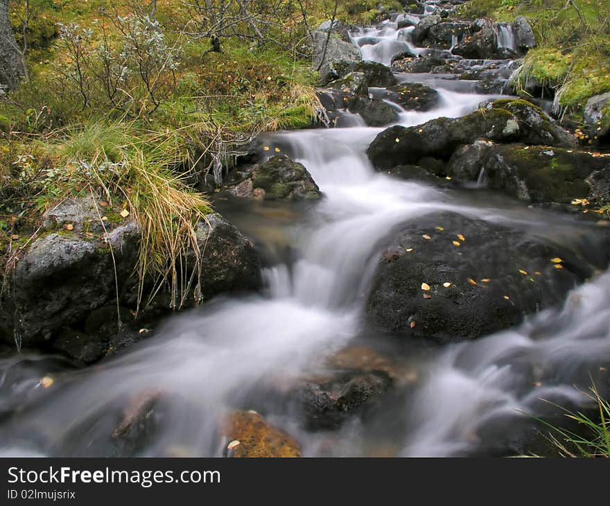 Beautiful landscape of flowing water from mountain stream. Beautiful landscape of flowing water from mountain stream