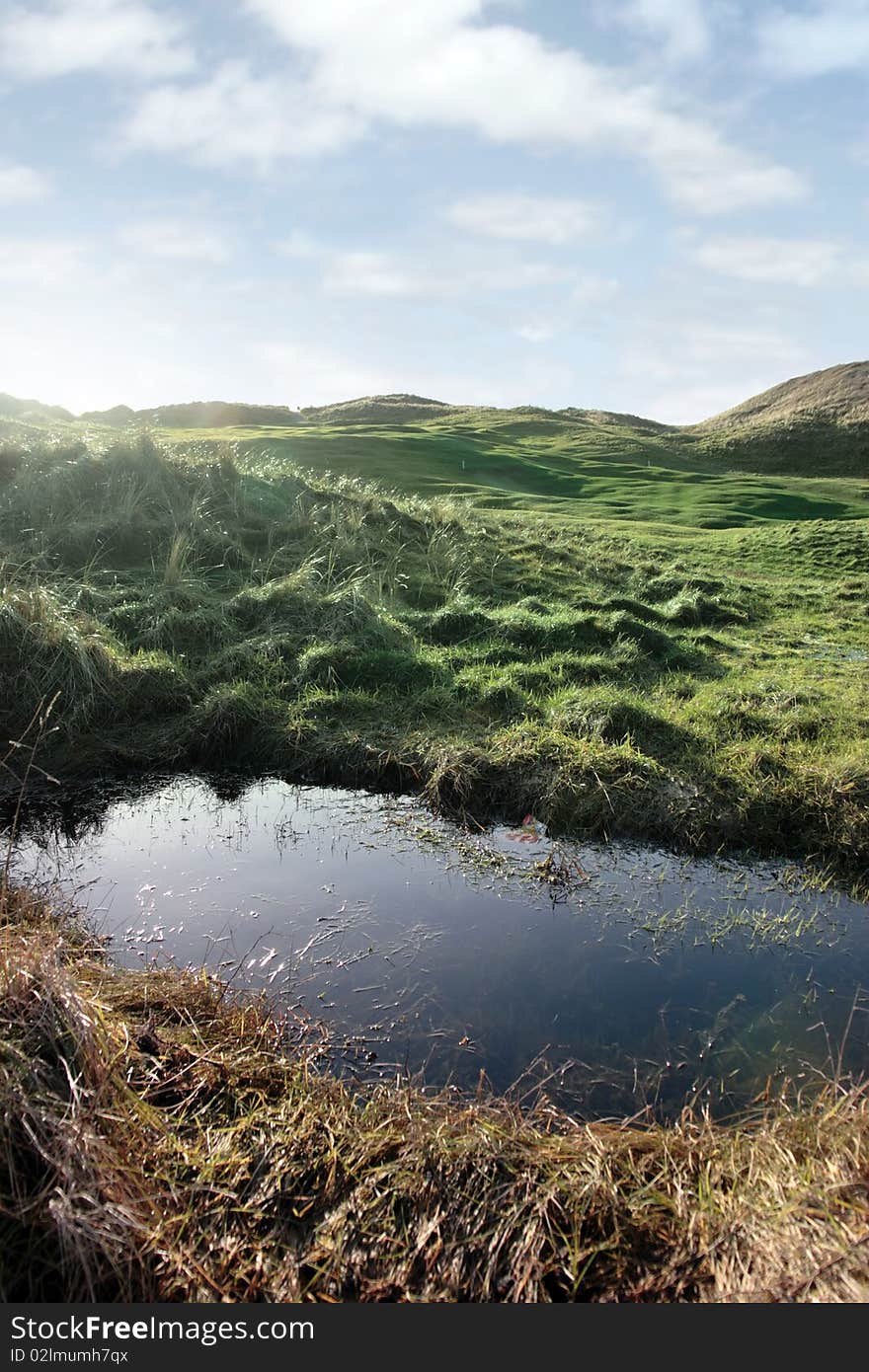 A water trap on a links golf course in ireland. A water trap on a links golf course in ireland