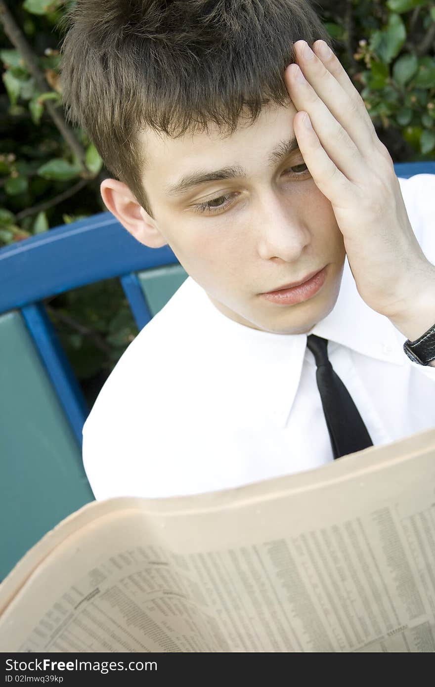 Young man Reading Newspaper