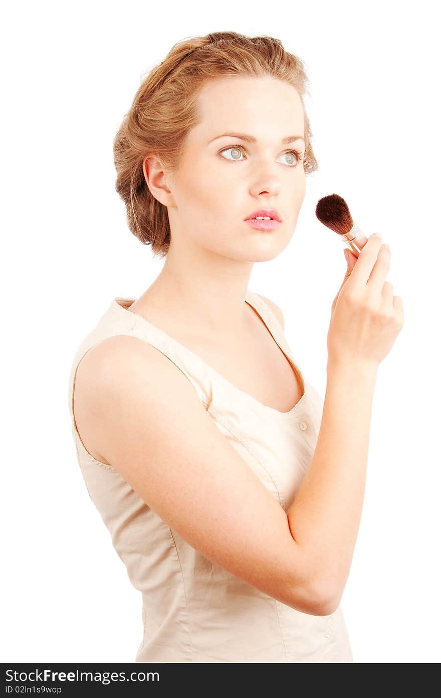 Girl with powder brush isolated on white