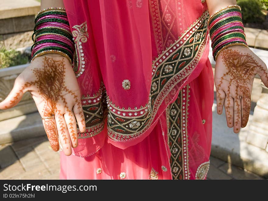 Young indian woman showing her hand with henna on it. Young indian woman showing her hand with henna on it